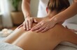 © Viktor - Close-up of a massage session. Therapist hands massage female client back. Relaxing spa wellness treatment, body therapy for stress relief. Massage for health and wellness. Spa treatment.