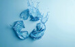 © Elena Uve - Recycle symbol made from water against blue background with copy space. Future is green.