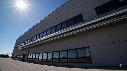Poster - Modern Industrial Architecture with Clear Blue Sky and Sunlight