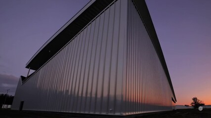 Poster - Industrial Building at Sunset with Vibrant Colors in Panorama View