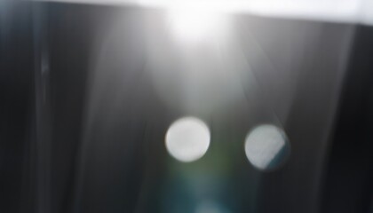 Fototapete - abstract light glare with blurred bokeh and lens flare on dark background for modern web design, branding visuals, or digital print texture graphic

