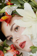 © SHOTPRIME STUDIO - Beautiful girl with natural makeup surrounded by vibrant flowers, capturing a serene and refreshing spring atmosphere with soft colors and gentle emotions