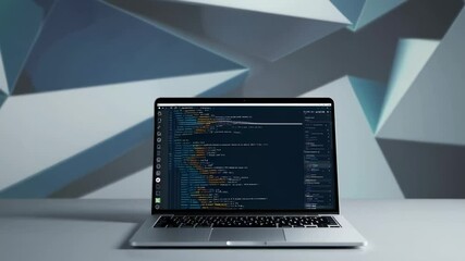 Aufkleber - Modern laptop displaying running code sits on a white table against an abstract geometric background, suggesting software development, programming, or technological innovation
