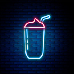 Fototapete - Glowing neon line Milkshake icon isolated on brick wall background. Plastic cup with lid and straw. Colorful outline concept. Vector