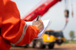 © Nattawit - An engineer or foreman is checking on safety checklist form of lifting crane at the drilling rig work site. Industrial safe working concent, close-up and selective focus.