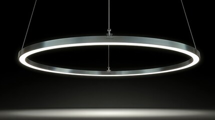 Poster - Circular light fixture illuminating a workspace with a bright glow creating an inviting atmosphere for productivity