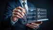 © Zone - Businessman marks digital checklist on a tablet.