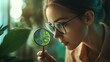 © Shayon - Close up of woman examining green plant through magnifying lens high resolution picture