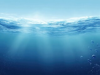 Poster - Serene Underwater Scene with Sunlight Filtering Through Clear Blue Water Surface Ripples