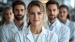 © Igas Studios  - Medical Team of Doctors in Modern Laboratory Looking at Camera