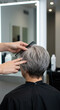© StockWorld - Freshly Styled Silver Pixie: Haircut, Comb, & Modern Elegance! Gray Hair Transformation, Salon Visit, Women's Style & Beauty