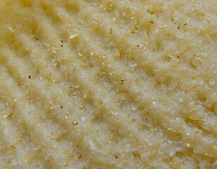 Poster - Crispy Potato Chip Texture Detail. Delicious Snack Surface. Golden Color, Ridges, And Enticing Oil Sheen. Close-up Of Savory Treat Ready To Enjoy. Perfect Snack Food Imagery.