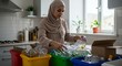 © Fudi - A Muslim Woman Sorts Recyclables in her Kitchen
