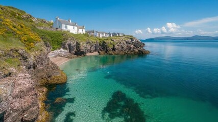 Poster - Scenic coastal view featuring crystal clear turquoise waters a small sandy beach and white cottages atop rugged cliffs under a bright blue sky