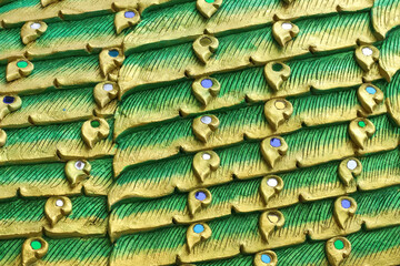 Wall Mural - Bird stucco feathers colorful texture yellow green on background