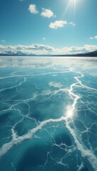 Aufkleber - Stunning Cracked Ice Landscape with Reflected Sunlight under a Clear Blue Sky