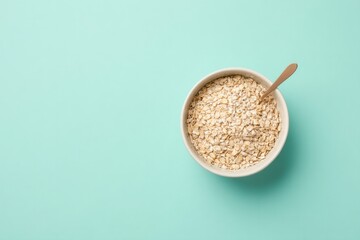 Poster - single bowl of oatmeal stands elegantly on smooth solid color background with ample copy space
