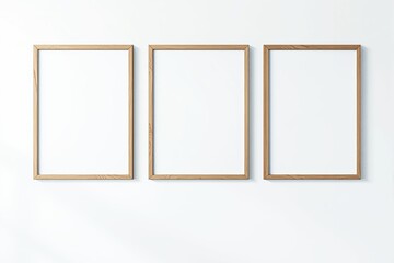 Poster - Three wooden blank picture frames hanging on a white wall.