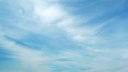Wall Mural - Blue sky with fluffy cloud time lapse on a sunny day 4k footage.