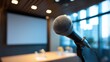 © AGI Studio - A close-up of a microphone in a modern conference room, ready for a presentation or public speaking event.
