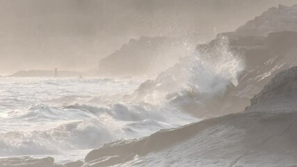 Wall Mural - powerful white ocean waves crashing against rugged rocky coastline in portugal, generating dramatic 