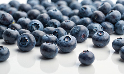 Poster - A fresh and juicy bunch of blueberries sits atop a clean white table