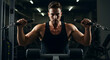 © sarinya - Intense Male Bodybuilder Engaging in Strength Training Workout