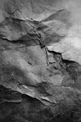 Poster - Dramatic texture of aged paper surface showcasing deep cracks and crevices in monochrome tones creating a vintage and artistic background for design projects