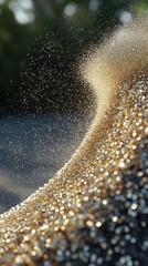 Poster - Captivating golden glitter cascade creating a mesmerizing wave of shimmering particles in a dynamic flow against a dark background evoking luxury and celebration