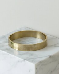 Poster - elegant golden ring on marble pedestal with soft light creating a sophisticated atmosphere for jewel