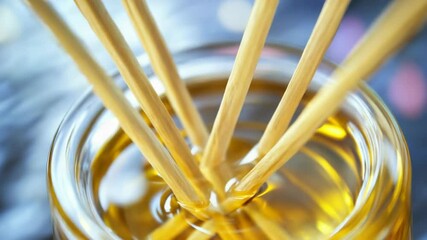 Aufkleber - A close-up of a glass jar filled with sticks, possibly for craft or decoration