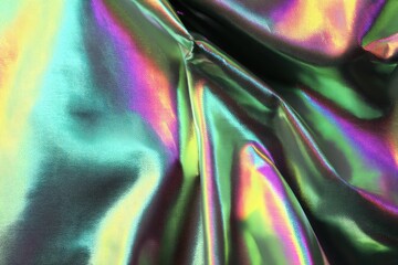 Poster - Iridescent fabric texture with vibrant colors and flowing folds creating a mesmerizing abstract background for modern design projects and artistic presentations