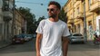 © Igorbmm - Man in white t shirt and sunglasses stands on street with buildings and cars in the background