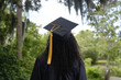 © Alyson - Graduate in cap and gown looking at nature