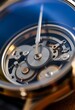 © KWY - close up of a watch face with a blue background