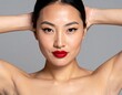 © Hirzan - Young Japanese woman with radiant skin wearing a white tank top