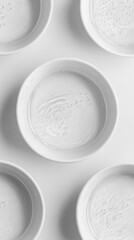 Poster - Minimalist Still Life of White Bowls Filled with Water on a White Background in a Studio Setting