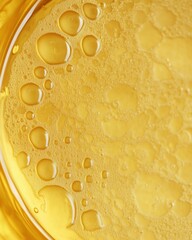 Aufkleber - Golden liquid with bubbles and droplets creates a textured abstract background image for design