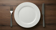 © sarinya - Empty Plate and Cutlery on Wooden Table Ready for a Meal Setup