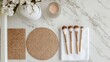 © Boonnam Burart - Top-down view of makeup brush cleaning mats and tools on a bathroom counter