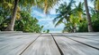 © sunstudio - Wooden floor with tropical beach and palm trees background in sunny day.