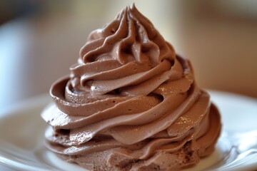 Poster - A close-up of a swirl of rich chocolate dessert, inviting with its smooth texture and delicate ridges on a white plate.
