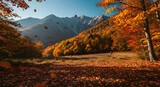 Brightly colored mountains in autumn with falling leaves