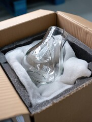 Aufkleber - Fragile Glass Object Securely Packed in Foam Within a Sturdy Cardboard Box for Safe Transport and Delivery Generative AI
