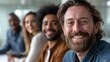 © liliyabatyrova - A group of joyful and diverse employees smiles together in a contemporary office setting, showcasing their camaraderie and collaborative spirit while enjoying a productive workday