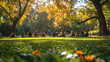 © ezen - Sunlit park scene, many people picnicking on grassy area under large trees