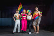 © Pituk - Pride month. Group Asian young gay happy while posing with gay pride rainbow flag at studio. People lifestyle fashion lgbtq concept