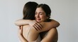 © Mateus - A woman finds solace in a hug while crying, receiving emotional support from a friend during a moment of sadness and vulnerability.