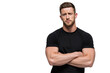 © Patrick Louvet - Muscular man in black sports shirt with arms crossed PNG with a transparent background