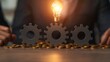 © vatcharapong - Economic Growth Innovation Competitiveness concept. Light bulb above gears symbolizing innovation and business ideas.